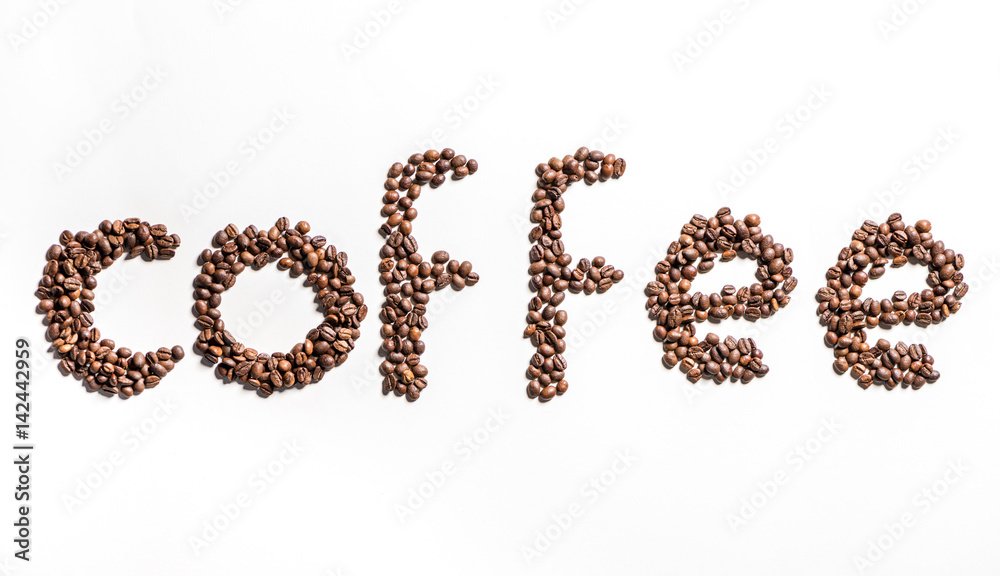 Top view of word coffee made from roasted coffee beans on white Top view of word coffee made from roasted coffee beans on white