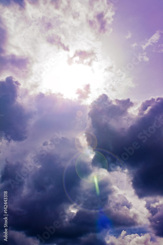 Bright blue sky, sun and fluffy beautiful clouds. Nature background, wallpaper.