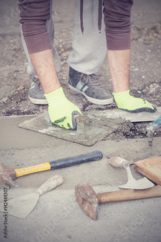 Renovating concrete pavement in home / budget DIY version.