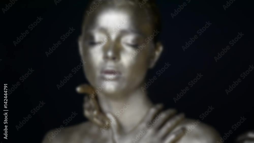 Girl painted silver. 6 hands on your face: see no evil,hear no evil, speak no evil. The image is blurred and out of focus . The mystical effect. Girl painted silver. 6 hands on your face: see no evil,hear no evil, speak no evil. The image is blurred and out of focus . The mystical effect.