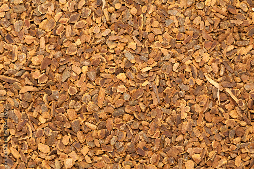 Dried Organic True Cinnamon (Cinnamomum verum) for Tea. Macro closeup background texture. Top view.