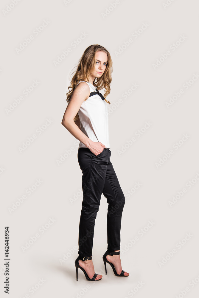 beautiful young girl in costume on light background beautiful young girl in costume on light background