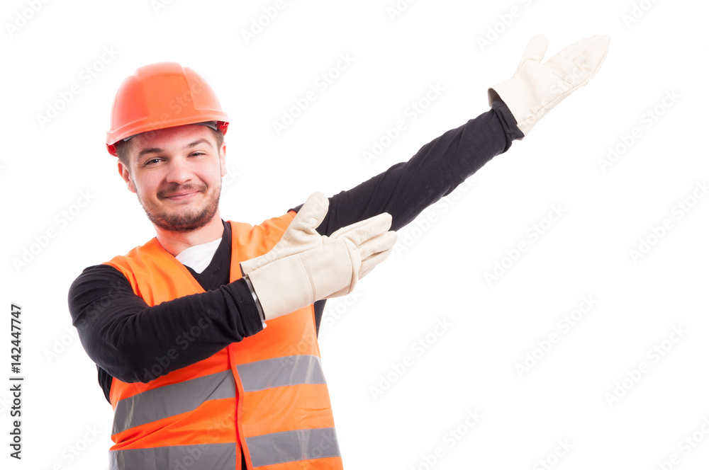 Architect with helmet showing something upwards Architect with helmet showing something upwards