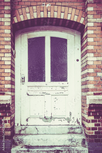 wooden door. front door. Vintage Retro Filter © EwaStudio
