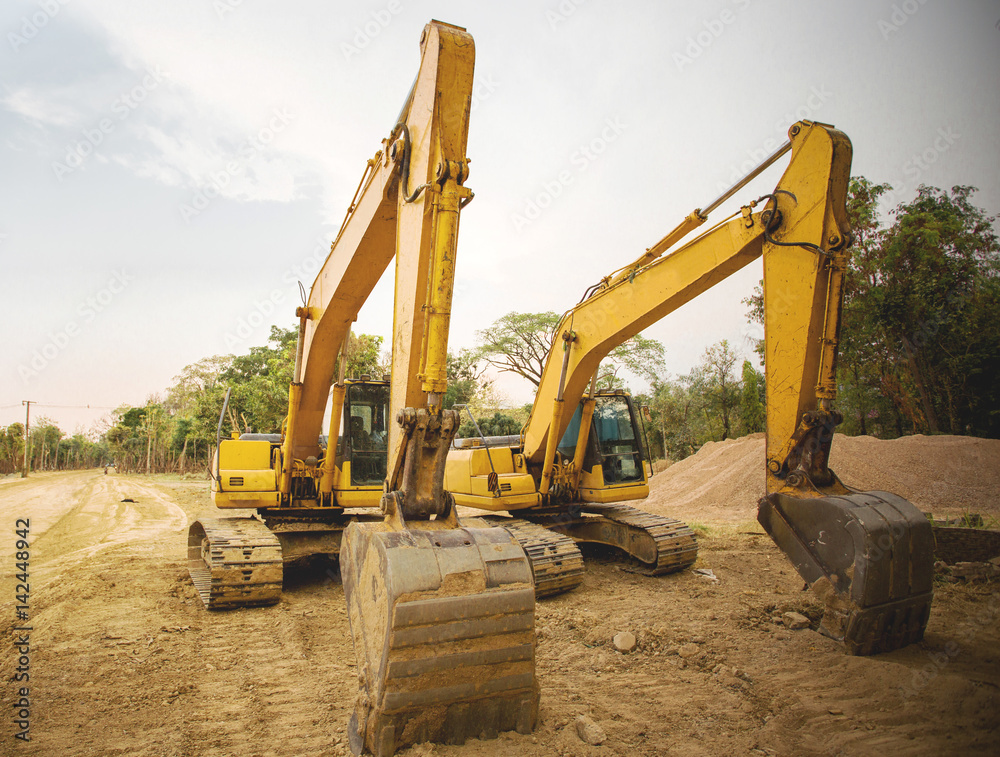 Excavators machine in construction site on sky backgrou