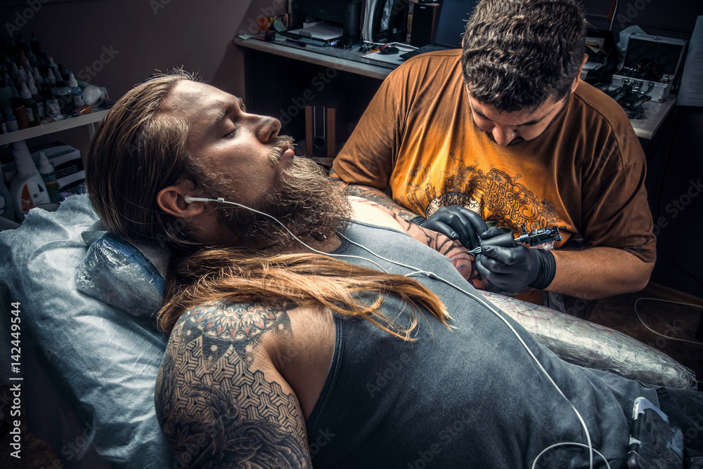 Fototapeta premium Professional tattooist posing in studio