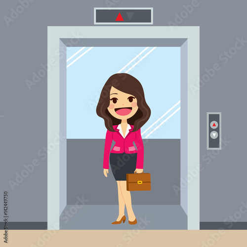 Young happy businesswoman using elevator at office