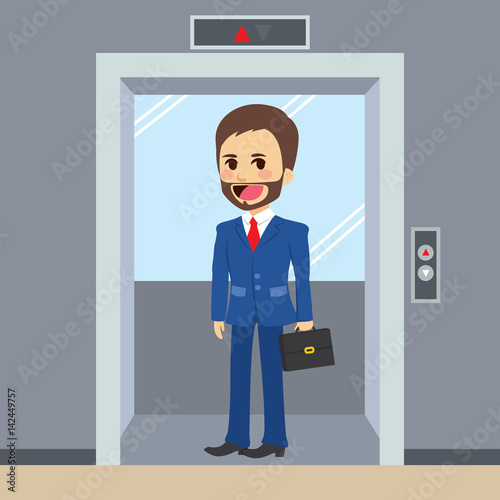 Young happy businessman using elevator at office