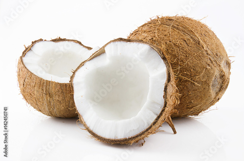 Ripe and appetizing coconut and its parts are isolated on white background