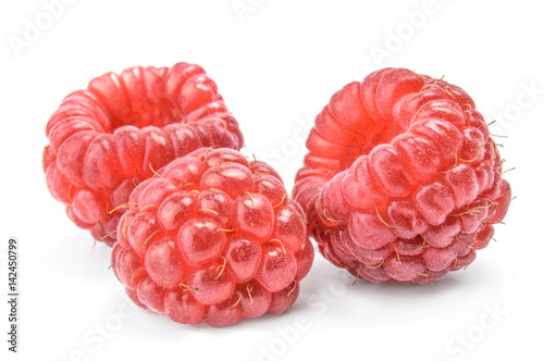 Three berries red raspberry on white background