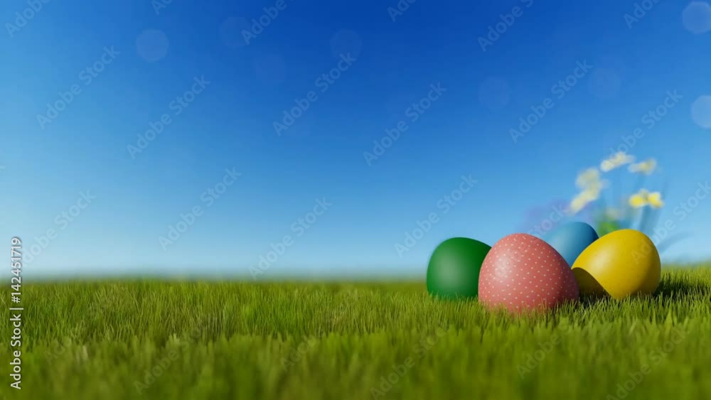 Colorful Easter eggs on green meadow over blue sky Colorful Easter eggs on green meadow over blue sky