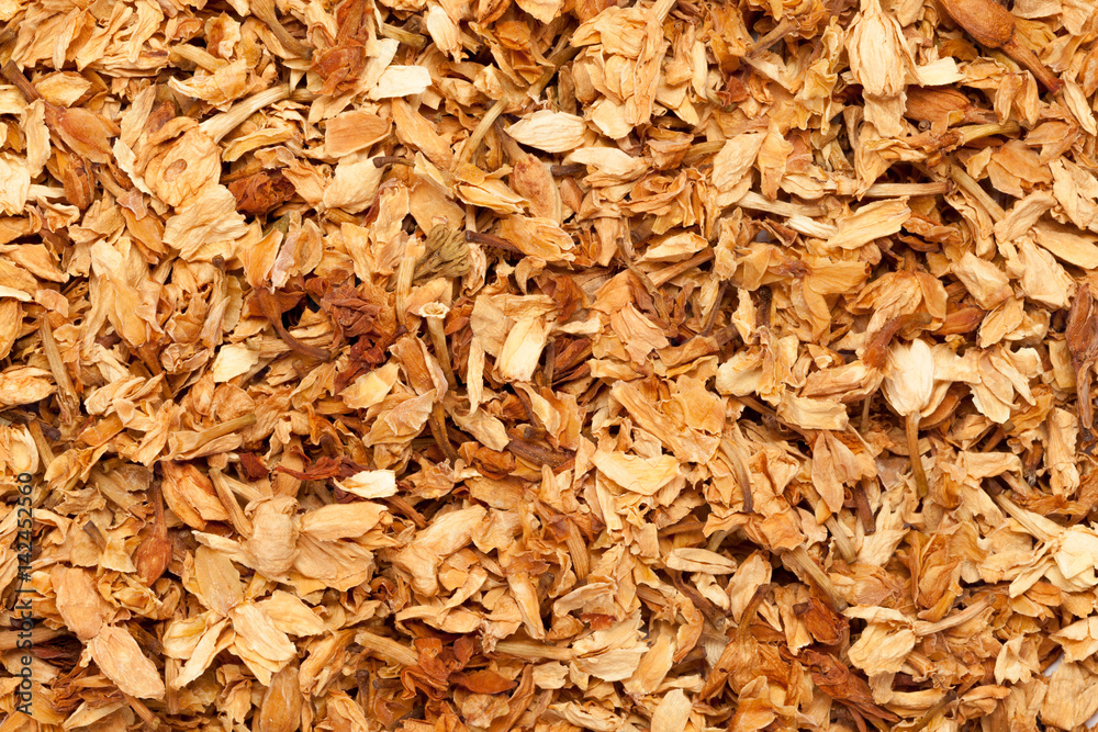 Dried Organic True Jasmine petals (Jasminum officinale) for Tea. Macro closeup background texture. Top view. Dried Organic True Jasmine petals (Jasminum officinale) for Tea. Macro closeup background texture. Top view.