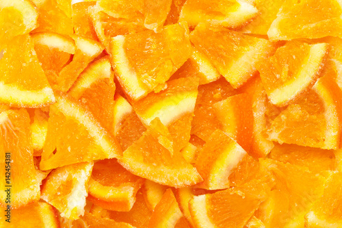 Organic air dried Sweet Orange (Citrus × sinensis) Fruit splits. Macro closeup background texture. Top view.