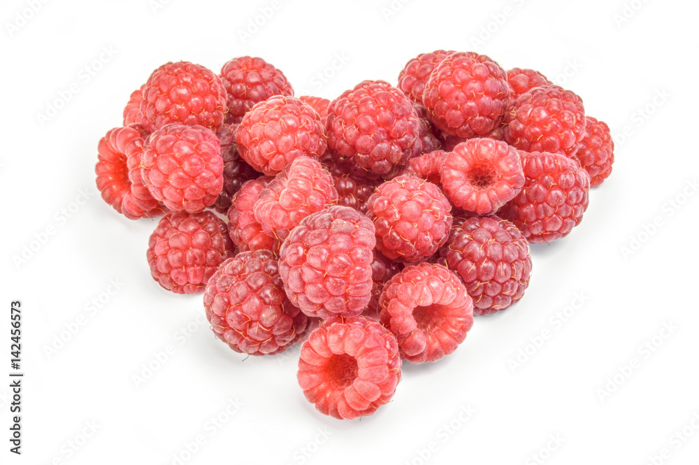 Heart shaped red raspberries isolated on white Heart shaped red raspberries isolated on white