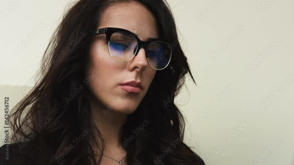 Close up portrait of young attractive woman looking at the laptop screen Close up portrait of young attractive woman looking at the laptop screen