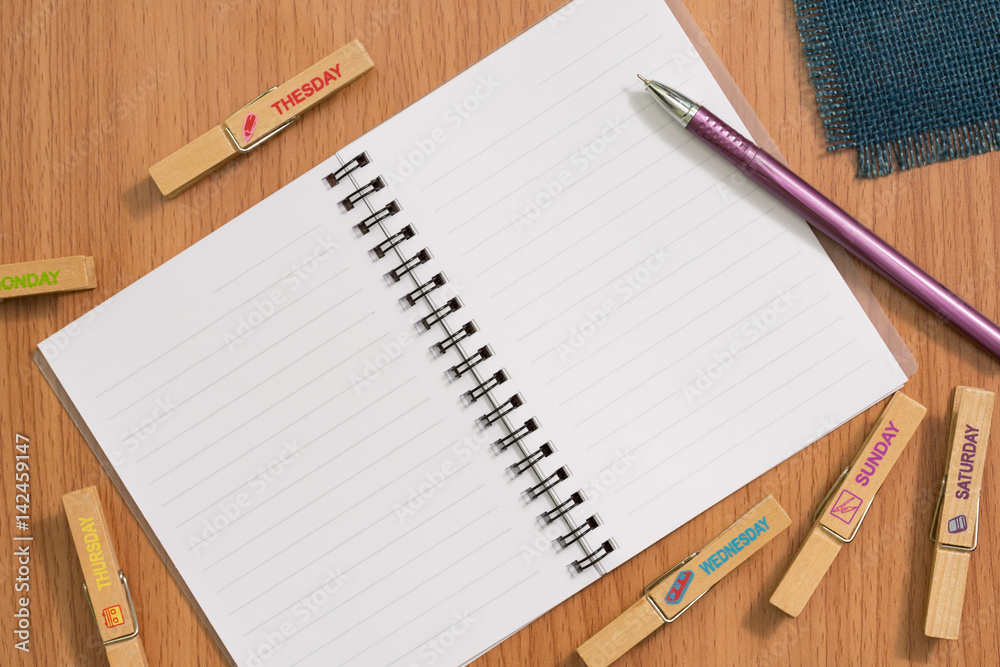 Blank notebook and pen on wooden desk for any idea on desk work. Blank notebook and pen on wooden desk for any idea on desk work.