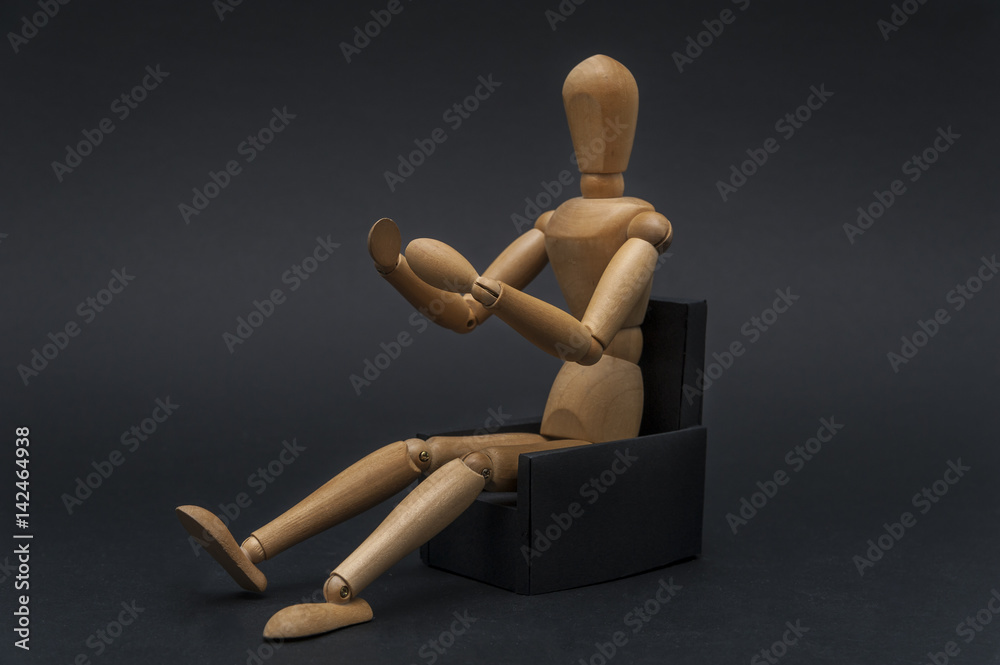 Wooden dummy representing a person in the driver seat while conducting a vehicle Wooden dummy representing a person in the driver seat while conducting a vehicle
