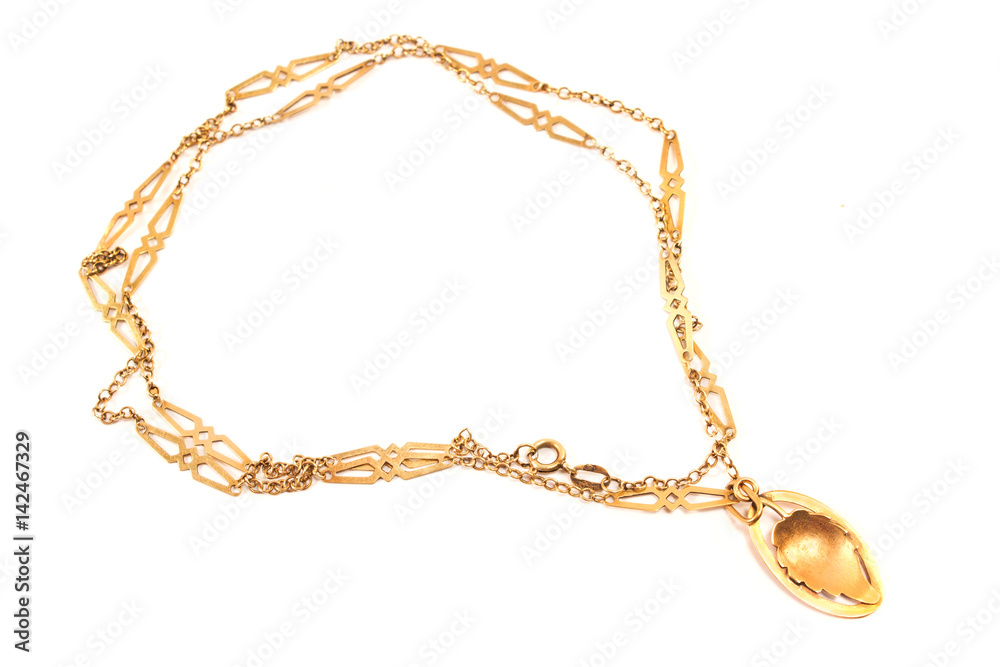Golden necklace with leaf pendant isolated on white Golden necklace with leaf pendant isolated on white
