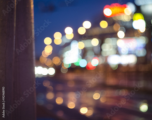 Blurred sky night city background circle round light.blur downtown construction structure backdrop. photo