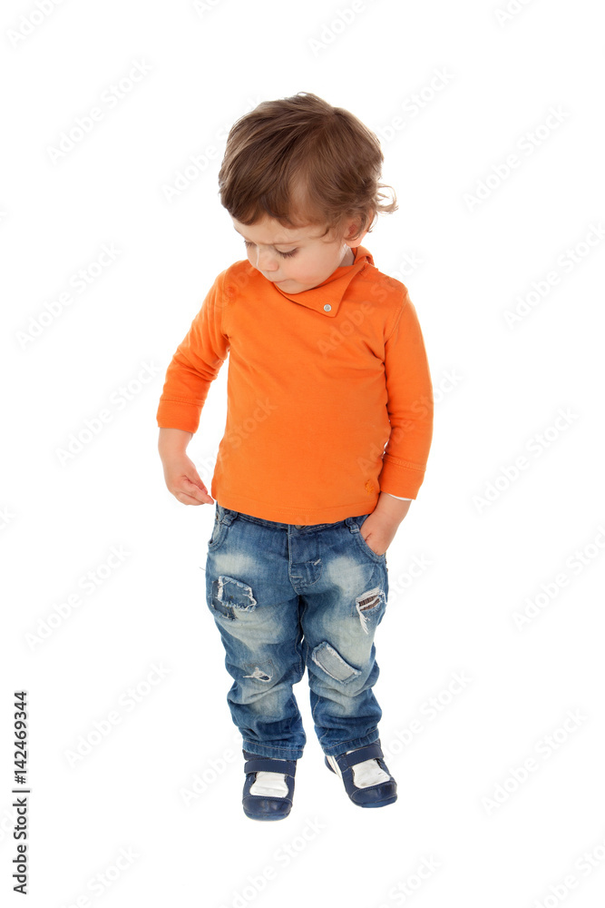Beautiful little child two years old wearing jeans and orange jersey Beautiful little child two years old wearing jeans and orange jersey