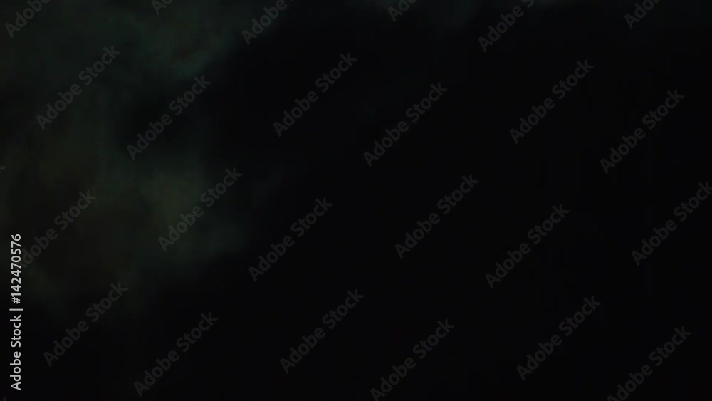 Moon behind clouds at night sky Moon behind clouds at night sky