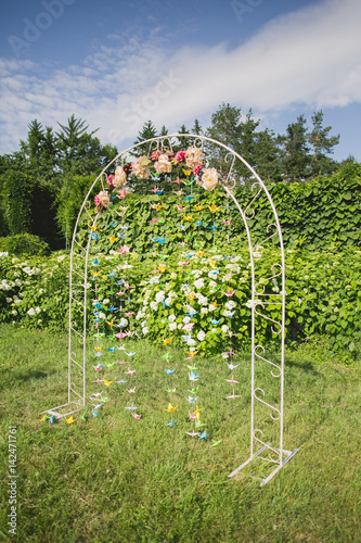 Flowers decorate wedding arch
