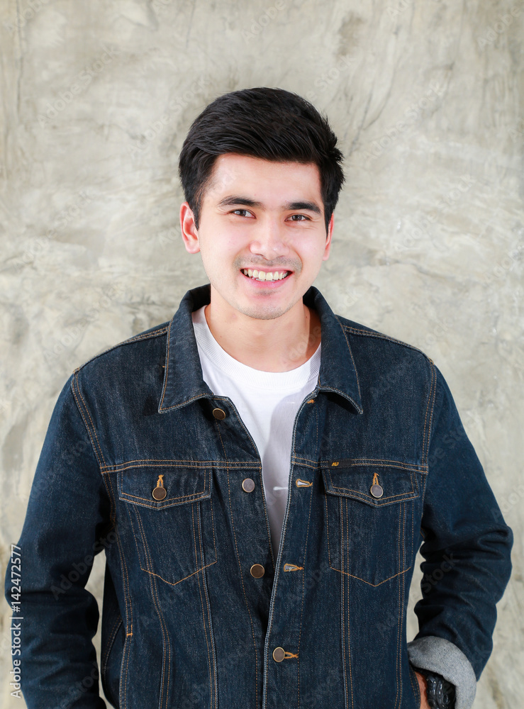 An Asian Man In A Black Denim Jacket And A Chain Necklace Posing