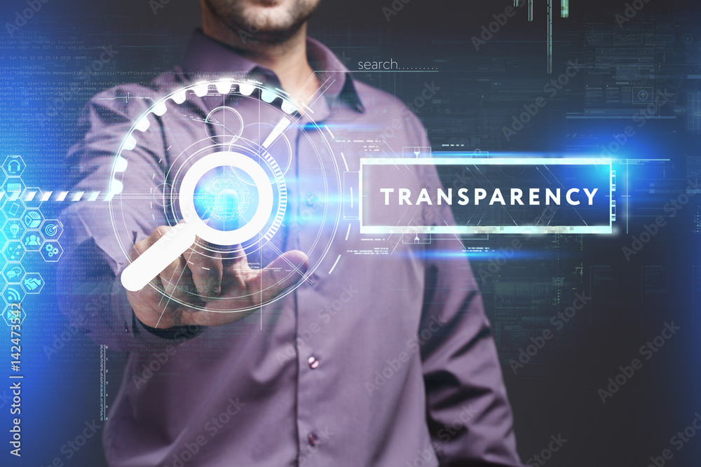 Business, Technology, Internet and network concept. Young businessman working on a virtual screen of the future and sees the inscription: Transparency Business, Technology, Internet and network concept. Young businessman working on a virtual screen of the future and sees the inscription: Transparency