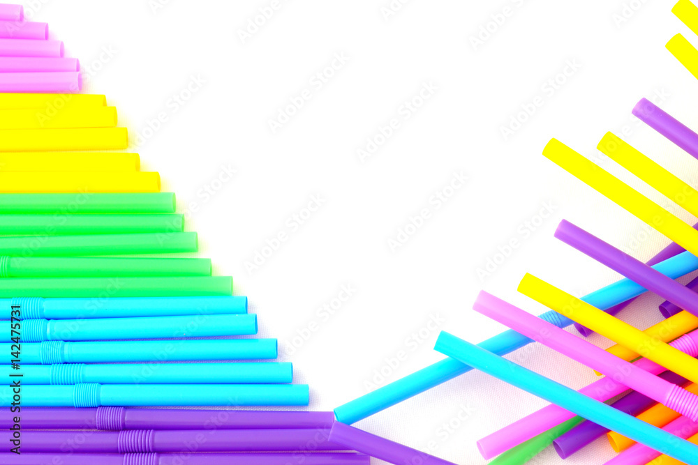 Abstract background with colored plastic straws and white space in the middle Abstract background with colored plastic straws and white space in the middle