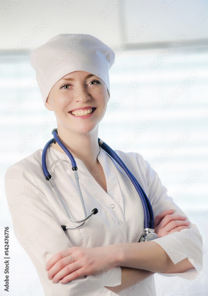 Medical doctor portrait in white coat and cap Medical doctor portrait in white coat and cap