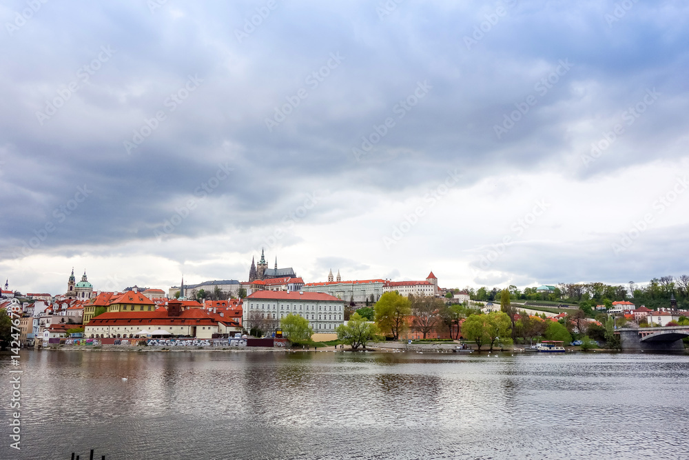Obraz premium Old Town ancient architecture and river pier in Prague, Czech Republic