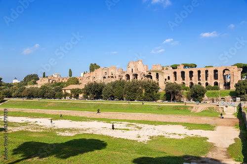 Rome, Italy. The Large Circus (Circus Maximus) in the background of the ruins of the imperial palaces on Palatine Hill.