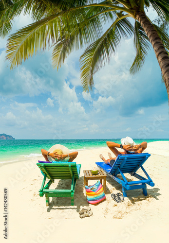 Couple on the beach at tropical resort Travel