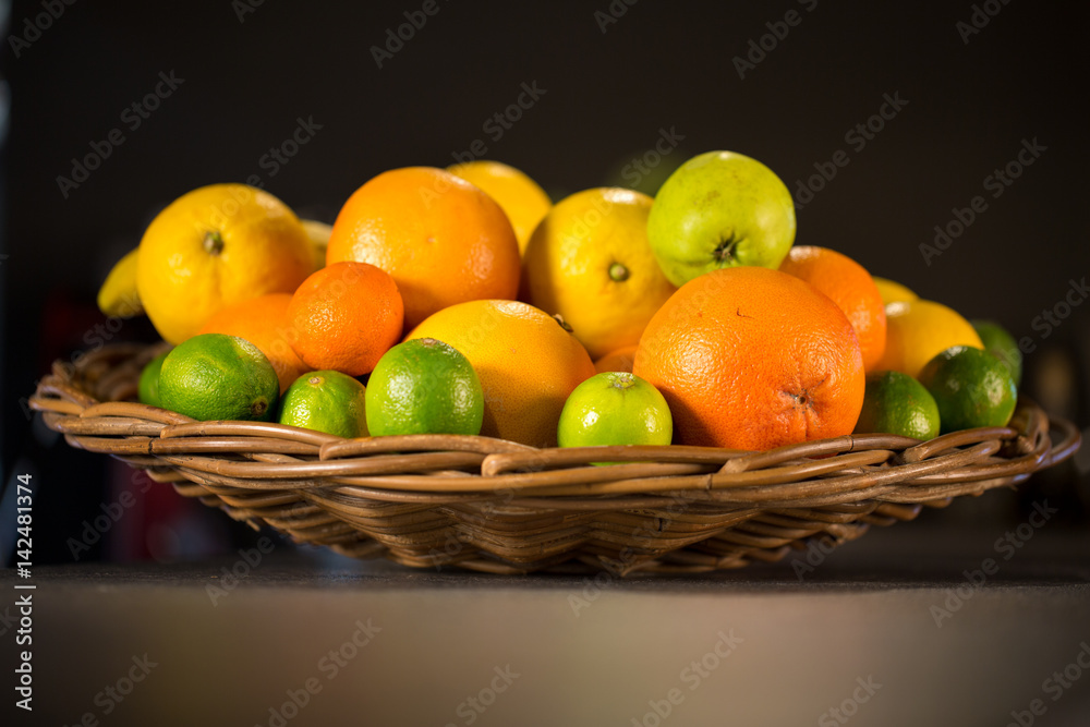 Wooden basket full of fresh fruits for lemonade and smoothies Wooden basket full of fresh fruits for lemonade and smoothies