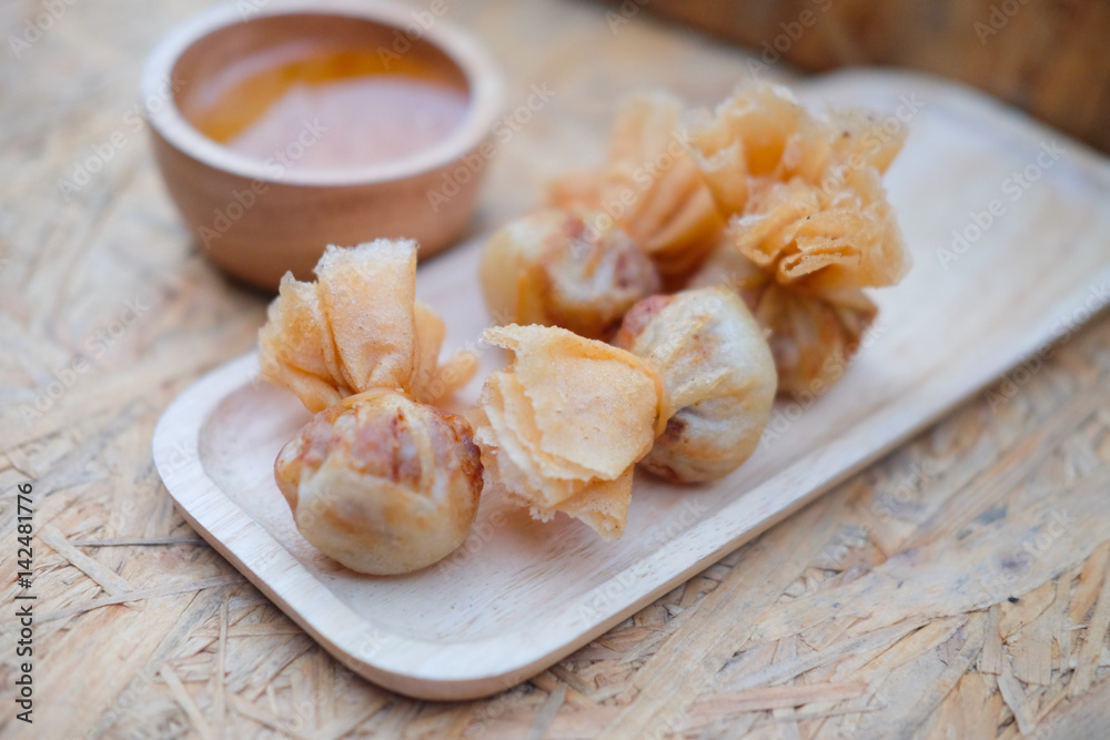 Deep fried shrimp dumplings with sauce