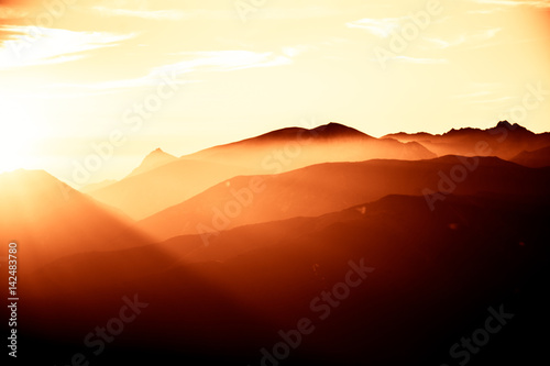 A beautiful, colorful, abstract mountain landscape in a red tonality. Decorative, artistic look.