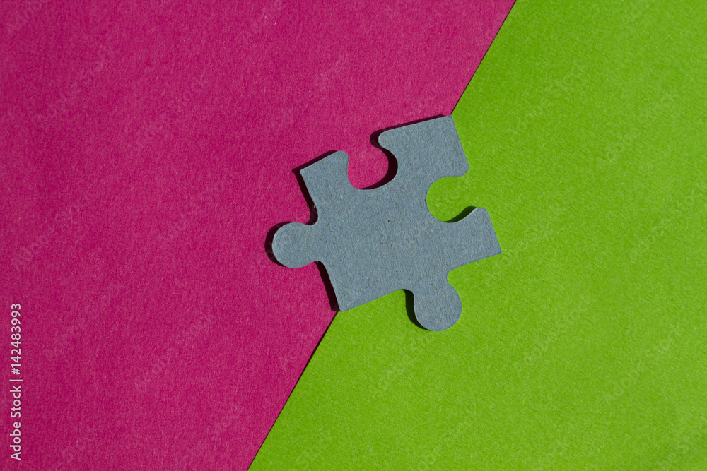 Jigsaw Puzzle pieces on border between pink and green background Jigsaw Puzzle pieces on border between pink and green background