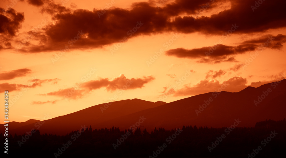 A beautiful, colorful, abstract mountain landscape in a red tonality. Decorative, artistic look.
