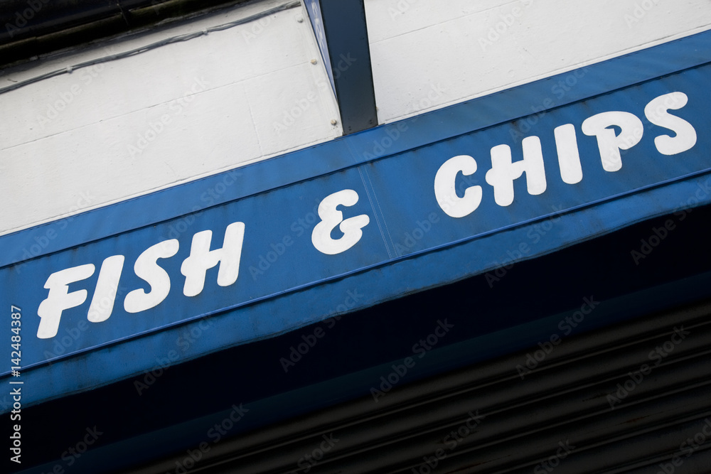 Blue Fish and Chips Sign on Shop Front Blue Fish and Chips Sign on Shop Front