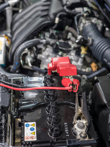 Car battery and jumper cables