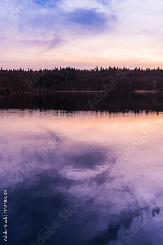 Pretty purple sunset reflected in a lake © Robert Herhold