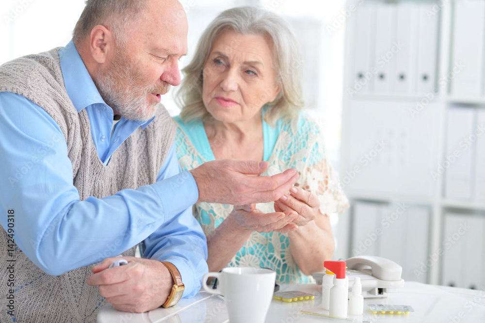 Elderly couple with pills Elderly couple with pills