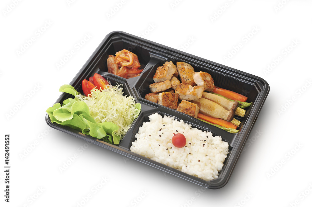 Isolated and clipping path of pork steak set in bento box set. Isolated and clipping path of pork steak set in bento box set.