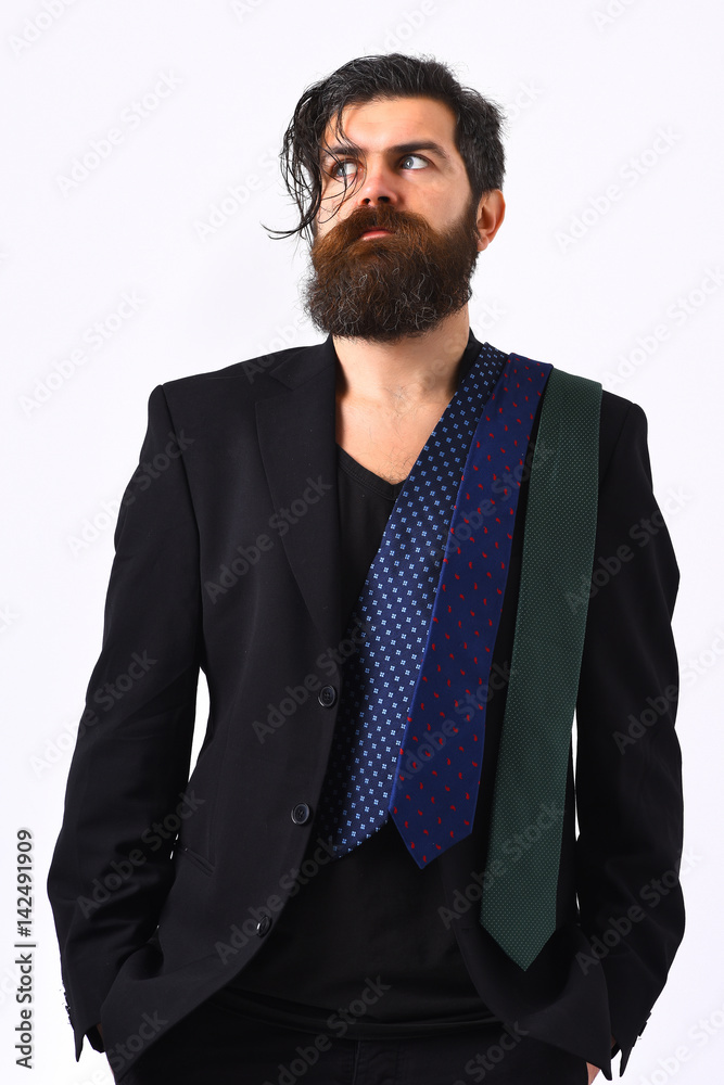 Brutal caucasian hipster in black suit with ties on shoulder Brutal caucasian hipster in black suit with ties on shoulder