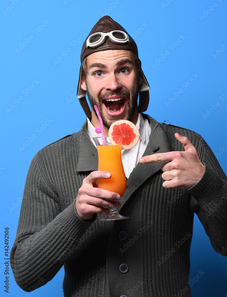 Fototapeta premium bearded pilot with cocktail in glass