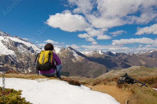 hiker in the French Pyrenees in spring with snow, col du Soulor