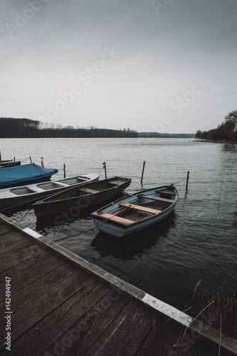 Boats on the lake pier © Creaturart