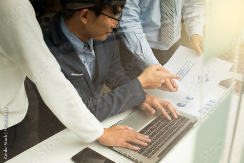 Teamwork process, Business People Discussion Marketing Plan Meeting Concept on table with laptop and financial document data in office.