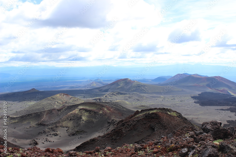 Black and red ash, valley of hills, after volcanic eruption Black and red ash, valley of hills, after volcanic eruption