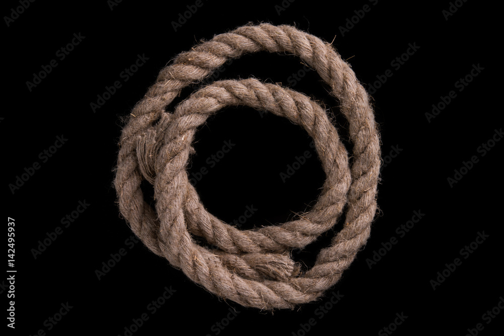Thick rope on a black background. Sea rope Thick rope on a black background. Sea rope